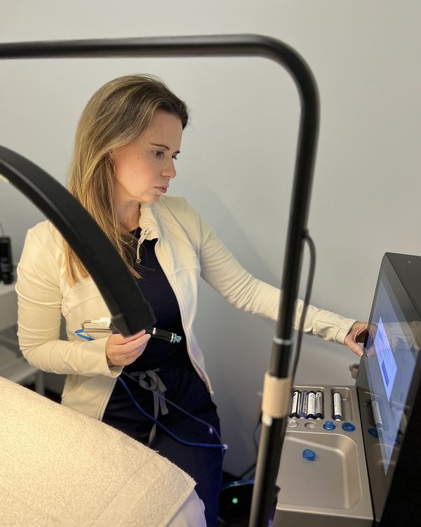 Haley Spring operating a laser device